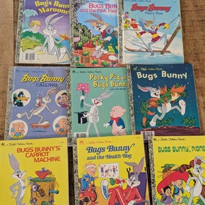 May include: A collection of vintage "Little Golden Books" featuring Bugs Bunny. The covers are brightly colored with illustrations of Bugs Bunny in various scenes. Titles include "Bugs Bunny's Carrot Machine" and "Bugs Bunny and the Health Hog."