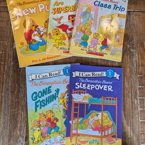 May include: A collection of five I Can Read! The Berenstain Bears books including New Pup, Are Superbears, Class Trip, Gone Fishin', and Sleepover. Each softcover book features colorful illustrations of the bear family and Scholastic branding.