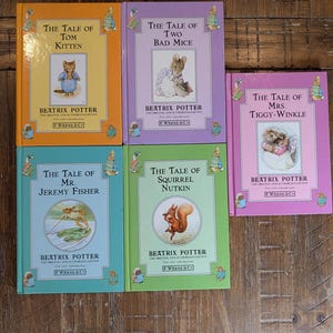 May include: A collection of five Beatrix Potter hardcover books titled The Tale of Tom Kitten, The Tale of Two Bad Mice, The Tale of Mrs. Tiggy-Winkle, The Tale of Mr. Jeremy Fisher, and The Tale of Squirrel Nutkin, featuring colorful covers.