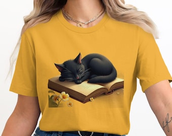Black Cat Sleeping on Book T-Shirt, Cute Literary Cat Tee for Women, Book Lover Gift, Cozy Kitty Graphic Shirt, Cat Mom Reading Top