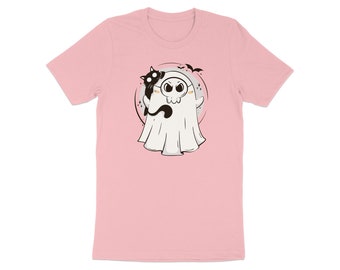 May include: A light pink t-shirt featuring a cartoon ghost with a black cat perched on its shoulder. The ghost has round glasses and a friendly expression. Bats and stars surround the ghost in a circular design.
