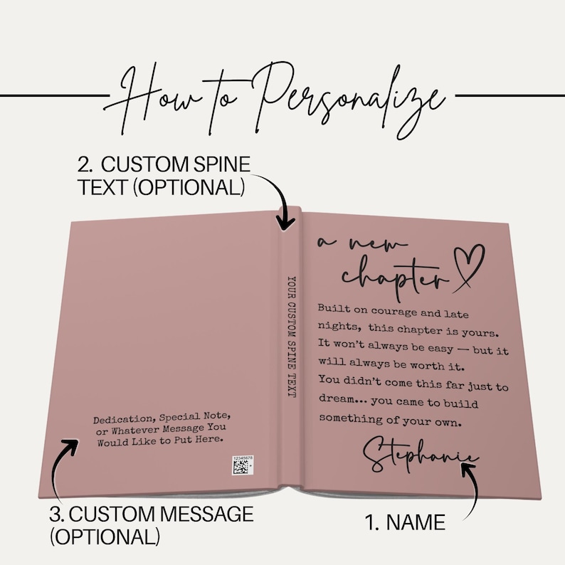 May include: Open book with a dusty rose cover, featuring the text "a new chapter" and a heart symbol. The book's interior displays personalized text, including a dedication and the name "Stephanie". The spine reads "YOUR CUSTOM SPINE TEXT".