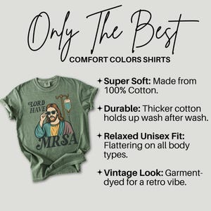 May include: Sage green Comfort Colors t-shirt with the text "Only The Best" and "Comfort Colors Shirts". The shirt features a graphic of Jesus wearing sunglasses with the words "Lord Have MRSA".