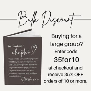May include: A dark gray journal with the words "a new chapter" and a heart symbol on the cover. The journal also includes the text "Take pride in the story you've written..." and the name "Stephanie". The image also includes the text "Bulk Discount".