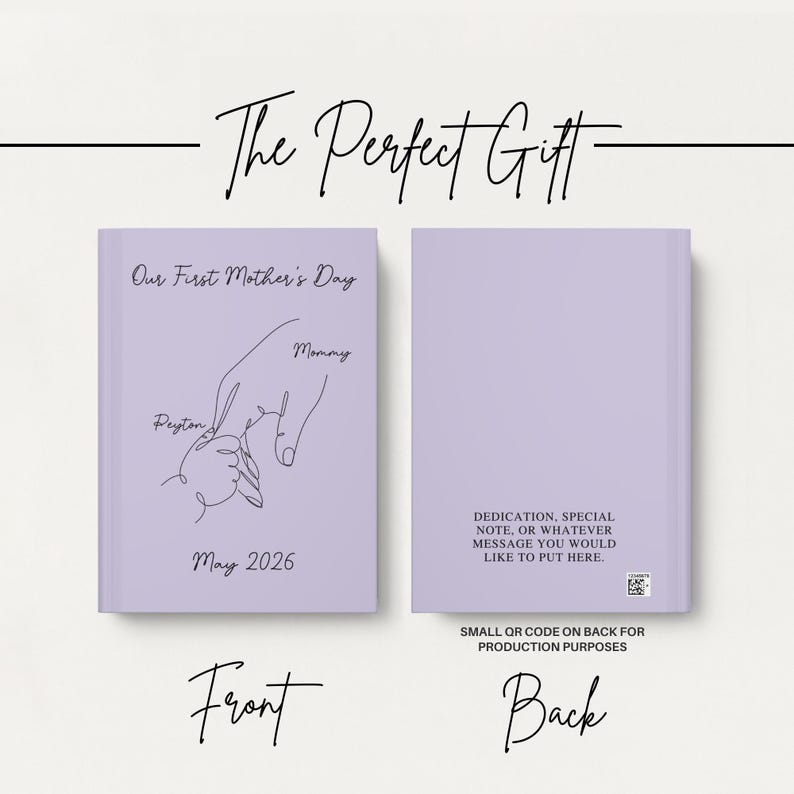 May include: A lilac journal featuring the text "Our First Mother's Day" and a line drawing of a hand holding a baby's hand. The journal also includes the name "Peyton" and the year "2026". The back of the journal has space for a dedication.