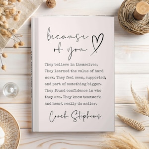 May include: A white journal with the text "because of you" and a heart symbol. The journal contains inspirational text about self-belief, hard work, and teamwork. The name "Coach Stephens" is at the bottom.