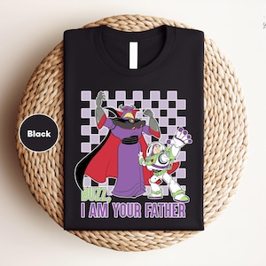 a black t - shirt with an image of cartoon characters on it