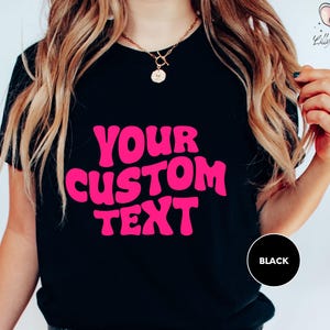 a woman wearing a t - shirt that says your custom text
