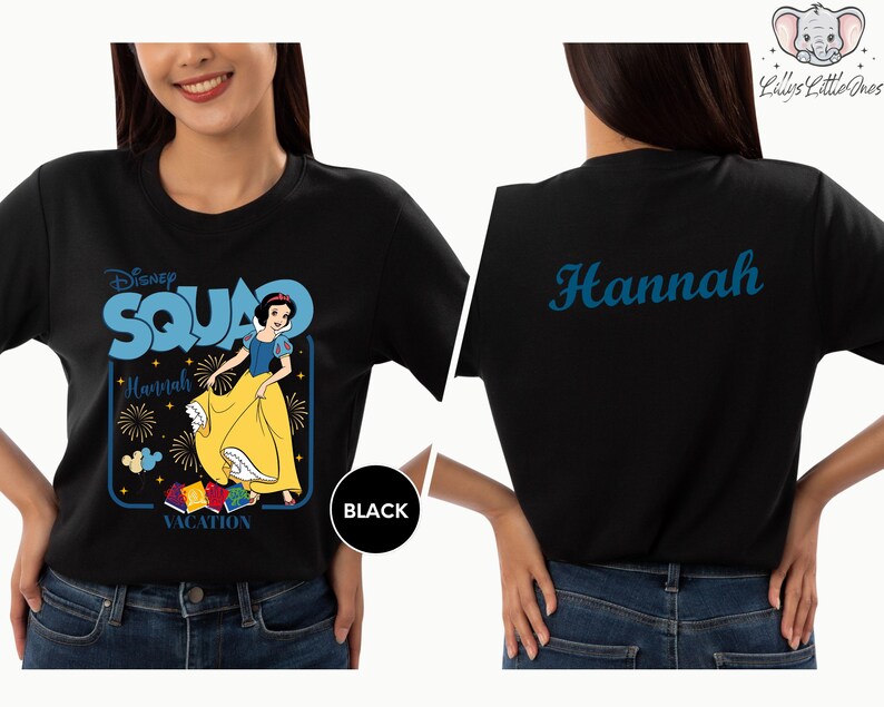 A woman wearing a black t-shirt with a Disney Square design featuring Snow White and the Seven Dwarfs.
