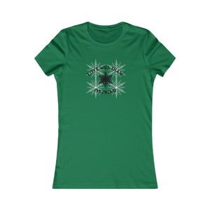 May include: A green women's t-shirt with a black snowflake design and the text "Love will thaw, we're proud".