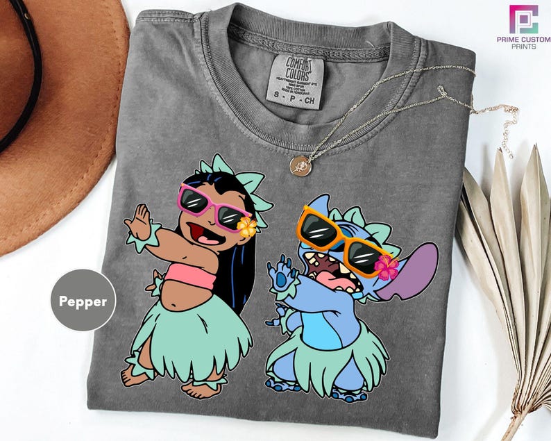 a couple of cartoon characters on a gray shirt