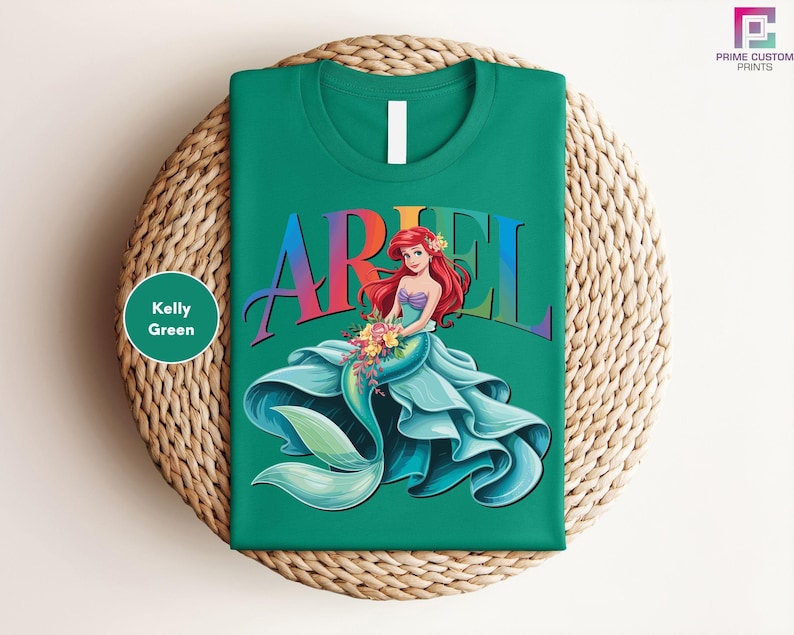 a green ariel t - shirt sitting on top of a wicker basket