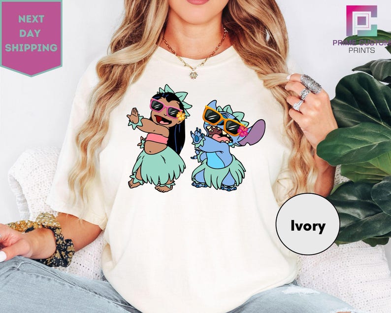 a woman wearing a white shirt with cartoon characters on it