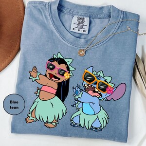 a blue shirt with a picture of two cartoon characters on it