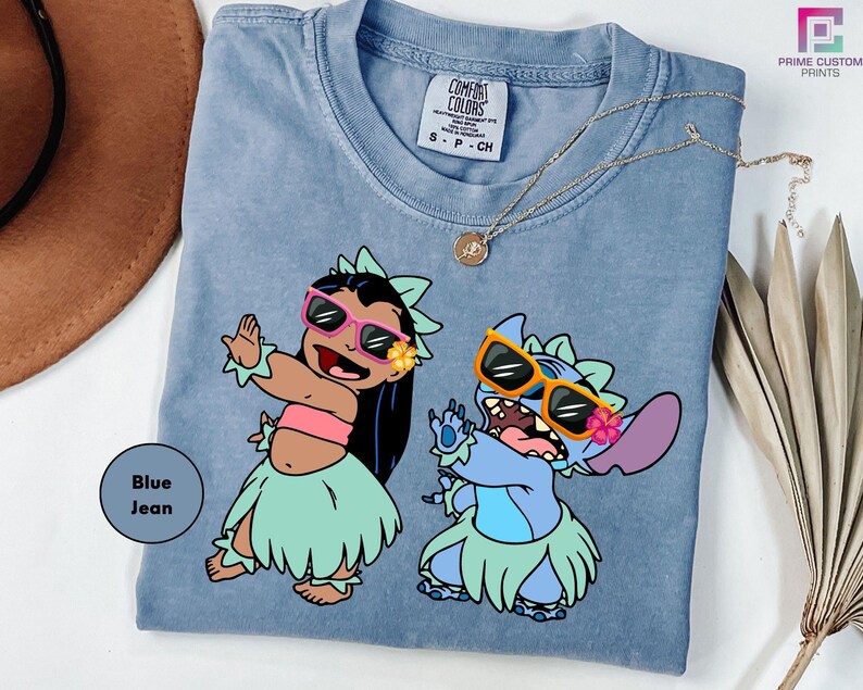 a blue shirt with a picture of two cartoon characters on it