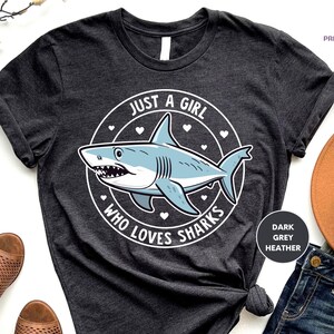 a t - shirt that says just a girl who loves sharks