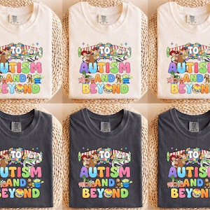 a woman wearing a t - shirt that says autism awareness and beyond