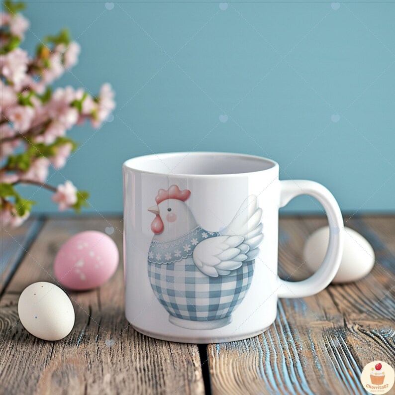 May include: White ceramic mug featuring a blue and white gingham chicken design. The mug has a handle and is resting on a wooden surface with pink and white Easter eggs.