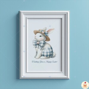 May include: A white bunny wearing a blue and white gingham dress and a straw hat with flowers. The bunny is sitting and looking to the left. The text "Wishing You a Happy Easter" is below the bunny.