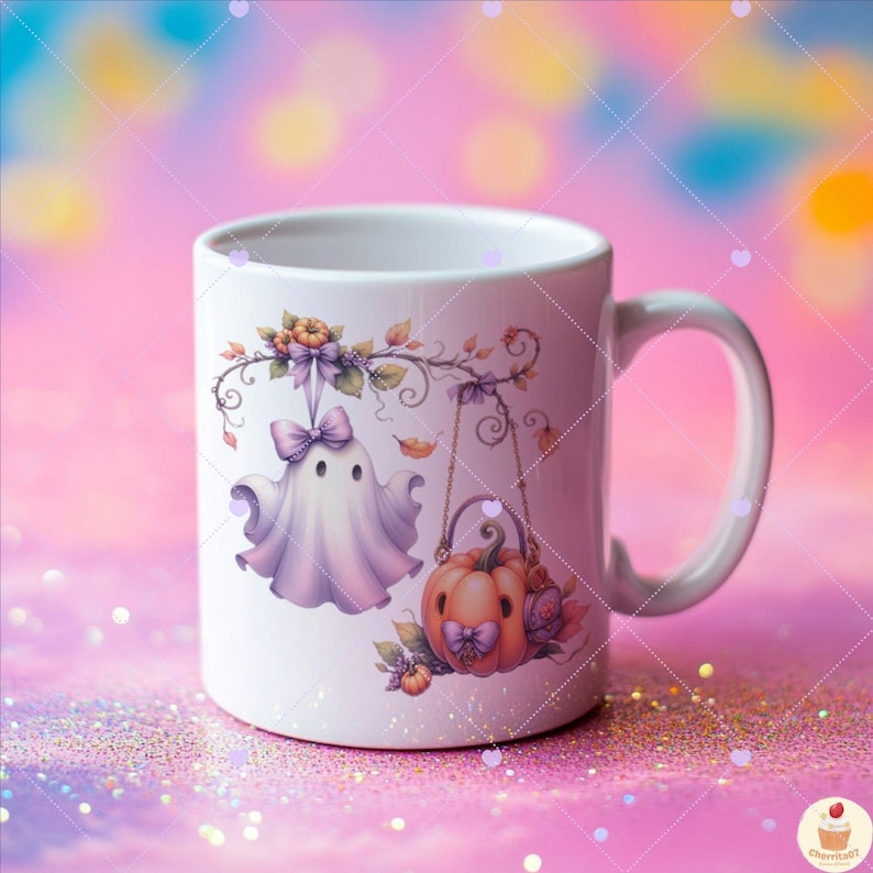 May include: White ceramic mug featuring a whimsical Halloween design. The design includes a friendly ghost with a bow, a pumpkin with a bow, and floral accents. The mug has a curved handle and is suitable for hot or cold beverages.