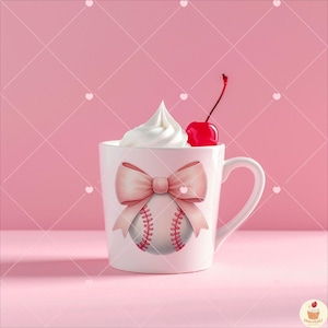 May include: White ceramic mug with a pink bow and a baseball graphic. The mug has a cherry on top.