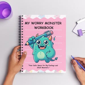 May include: A pink and white spiral bound workbook with a cartoon green monster holding a pencil. The cover reads "My Worry Monster Workbook" and "Your Safe Space for Big Feelings and Small Monsters."