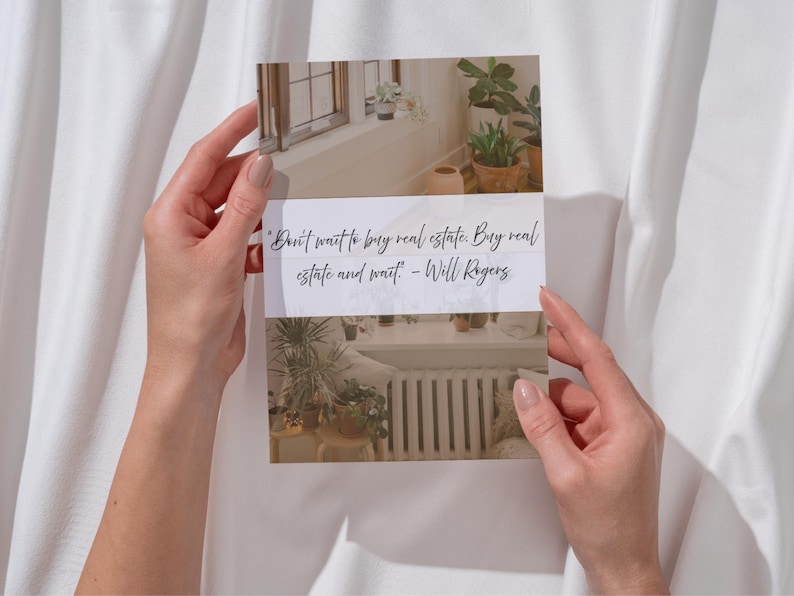 May include: A printed card with a quote by Will Rogers: "Don't wait to buy real estate. Buy real estate and wait." The card features images of a window with plants and a radiator. The card is held against a white fabric background.