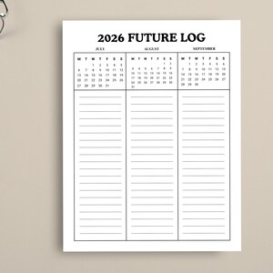 May include: A white 2026 Future Log planner with a calendar for July, August, and September. The planner has lined sections for notes. The text "2026 FUTURE LOG" is at the top.