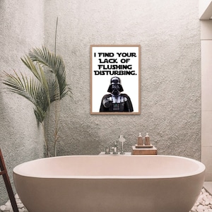 May include: A bathroom with a white bathtub and a framed print of Darth Vader saying "I find your lack of flushing disturbing."