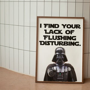 May include: A framed poster with a black and white image of Darth Vader from Star Wars. The poster has the text "I find your lack of flushing disturbing."
