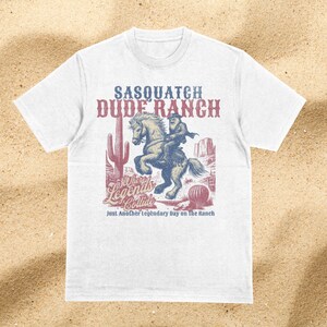 Sasquatch Dude Ranch Shirt Cowboy Shirt Bigfoot Shirt Cryptozoology Shirt Western Shirt Cryptid Shirt Funny Shirt Comfort Colors Shirt