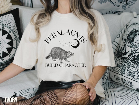 Feral Aunt Funny Tee: Quirky Raccoon Meme, Weirdcore Art (Unisex Cotton Shirt, Soft Washed Fabric)