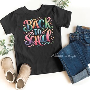 May include: Black t-shirt with a colorful "Back to School" graphic. The graphic features a rainbow color scheme and a playful font style.