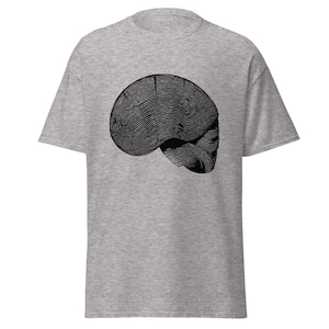 May include: A gray t-shirt with a black and white graphic of a skull with a fingerprint pattern.