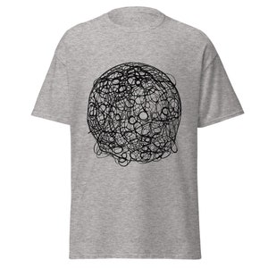 May include: A light gray t-shirt featuring a black abstract design of interconnected circles and lines, creating a spherical shape. The short-sleeved shirt is made of a soft material.