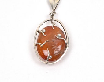 Handmade carnelian and silver pendant