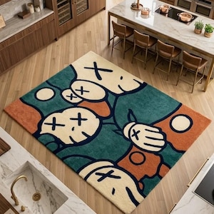 Abstract hand tufted KAWS inspired rug with bold cartoon faces in green, cream, orange and navy tones, luxury modern plush area rug for living room bedroom decor