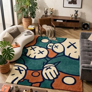 Abstract hand tufted KAWS inspired rug with bold cartoon faces in green, cream, orange and navy tones, luxury modern plush area rug for living room bedroom decor