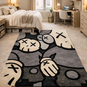 Hand tufted monochrome abstract cartoon style rug with bold black outlines and plush wool texture placed in a modern luxury living room setting.