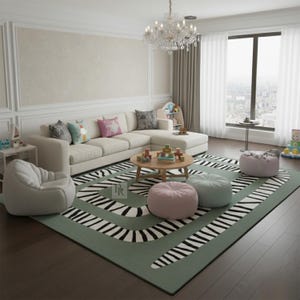 May include: A living room featuring a cream-coloured sectional sofa, a round wooden coffee table, and a green rug with a black and white zebra stripe pattern. The room includes a chandelier, beanbag chairs, and decorative cushions.