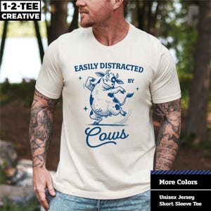 Easily Distracted By Cows T-Shirt, Fun Farm Animal T-Shirt, Gift for Cow Lovers, Unisex Graphic T-Shirt, Cute Country Apparel.