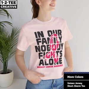 In our Family Nobody Fights Alone T-Shirt, Breast Cancer Awareness, Pink Ribbon, Fight Cancer, Fight Together, Man Women Breast Cancer.