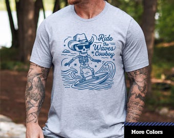 Funny Skeleton Surfing Cowboy T-Shirt: Halloween Beach Party Tee