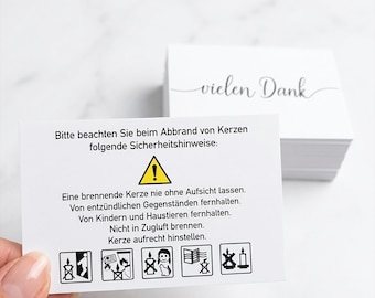 100 tarjetas con instrucciones de seguridad para velas, 300 g – Doble cara: «Gracias» y avisos de advertencia según la norma DIN EN 15494 – Color blanco, formato tarjeta de visita.