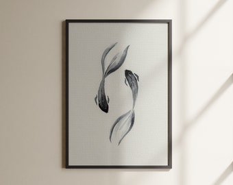 May include: A black framed print of a watercolor painting of two black and white fish swimming in a white background.