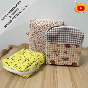 May include: Three fabric pouches with zippers. One is bright yellow with a small white floral print. Another is white with a dense multicolored floral pattern. The third features a brown and white gingham top and a beige bear and cherry print.