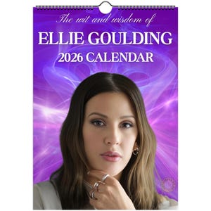 May include: A 2026 calendar with the text "The wit and wisdom of Ellie Goulding". The calendar features a portrait of Ellie Goulding against a purple background. The calendar is spiral-bound.