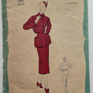 May include: A vintage sewing pattern for a red skirt suit. The pattern is from Les Patrons Favoris, Série Mode, and is size 44. The price is 60 FR. The pattern features a woman wearing the suit, and a back view of the suit.