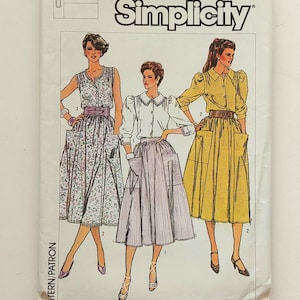 May include: Simplicity sewing pattern number 6907 for sizes 12-14-16. The pattern shows three different styles of skirts with pockets and a belt. The skirts are in floral, striped, and solid yellow fabric.