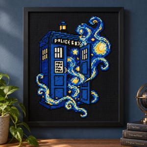 May include: A framed cross-stitch artwork featuring a blue police box with the text POLICE BOX on the top panel. The design includes swirling yellow and blue patterns reminiscent of a starry night sky, set against a black grid background.